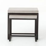Nested tables from slightly lower front perspective showing concrete top edges and frame legs