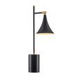 Lamp showing off matte brass accents on stem joints and top finial