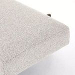 Close-up macro shot of upholstery fabric corner showing thick padding and knit weave