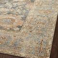 Close-up of Margot Ocean Spice rug edge highlighting color variation and pattern details on hardwood floor