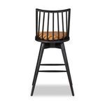 Close-up detail of footrest ring and tapered black oak legs