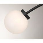 Close-up of single white strie glass orb with matte black holder on Redfield light