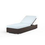 Montecito Adjustable Chaise with Cognac multi-colored resin wicker and white cushioned seat, backrest angled for reclining