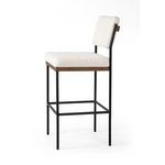 Angled side profile of Benton Stool displaying seat thickness and frame structure