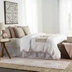 bedroom setting with low pile pink and white runner rug beside bed on woven seagrass carpet