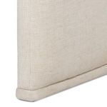 Close-up of bottom corner seam and piping detail on the chair’s upholstery