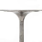 Detailed side profile of the neck area where the base flares to the tabletop, with textured finish