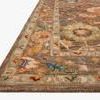Close-up side angle showing thick hooked wool texture and detailed multicolor border of Padma Charcoal Multi Rug.