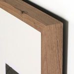 Close-up of walnut frame corner detail with natural wood grain and knots visible
