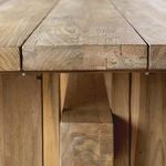 Close-up of edge detail featuring smooth plank surface and visible wood knots and grain