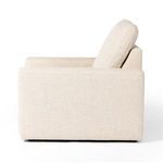 Side profile highlighting angled back cushion and armrest shape of power recliner