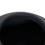 Looking down into the wide circular opening of the black terracotta vase