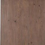 Close-up view of the desk's sundried ash wood grain with natural texture and knots