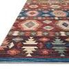 Angled view of Zion Fiesta rug showing flat weave texture and stitched edges