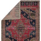 Rug corner flipped to reveal light taupe reverse with faint medallion pattern