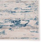 Zoom on pattern detail with visible distressed blue and gray abstract shapes