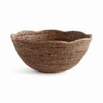 Warm brown Burma rattan bowl with tight weave and scalloped edge in round shape