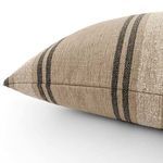 Close-up side view showing textured woven fabric and clean stitched seams of pillow
