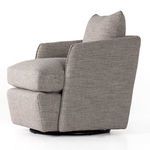 Side profile of Whittaker Swivel Chair showing seat cushion depth and armrest curve
