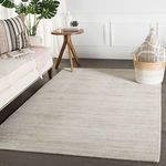 Rug styled in a modern living room with wood floor and neutral decorative accents