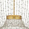 Bottom close-up of bead strands forming bell-shaped drape over smallest gold ring