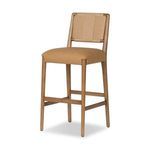 Three-quarter view showing the Rothler stool’s woven back and seat depth