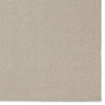 Close-up of the rug’s beige border area with finely woven fiber details