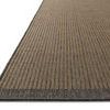 Close-up side view of Providence rug showing flat woven texture and charcoal binding