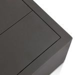 Close crop revealing the precise seams between slats on the table's top surface