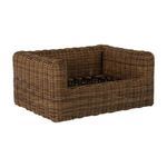 Close-up of armrest corner detailing the woven texture and rounded wicker strands