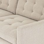 Close-up of button tufting and textured perpetual pewter upholstery fabric on sectional