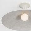 Close-up of the light bulb slightly protruding below the rounded bowl-shaped shade