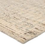 Angled close-up highlighting wool texture of light cream stripes with subtle brown and gray flecks