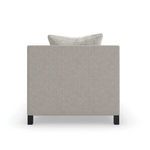 Direct back view of the chair featuring smooth neutral upholstery and metal legs