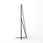 Side profile of the oval floor mirror showing thin metal support arm