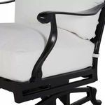 Close-up on the front armrest curve with white cushion and black metal frame below