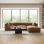 Sectional featuring multiple Matina Slipper Chairs in a bright room with large windows and light rug