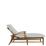 Side view of chaise with white cushions showing plush padded seat and backrest
