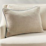 Elias Pillow styled on cream-colored sofa highlighting size and neutral tone