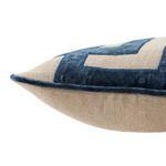 Side view highlighting pillow thickness and blue velvet piping detail