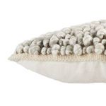 Close-up of side profile highlighting the boucle texture and beige knit edging