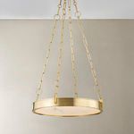 Front view of chandelier suspended with alabaster diffuser softly glowing