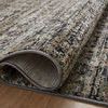 Close-up of curled Soho Charcoal rug edge showing dense pile texture and color flecks