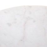 Top-down close-up of marble surface featuring white smooth finish with soft gray and subtle pink veining