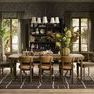 Dining room setting featuring multiple Artie Dining Chairs around wooden table on patterned rug