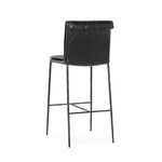 Rear view of Mayer Stool highlighting rolled leather top edge and iron frame support bars