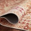 Rolled edge of Layla Rug displaying backing material and flexible polyester weave