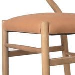 Close-up of the leather seat cushion and front ash leg joinery and support rails