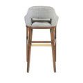 Straight rear view of Inga Stool highlighting wood and fabric contrast with brass footrest