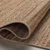 Folded Merrick Oatmeal Multi rug showing backside texture and thickness